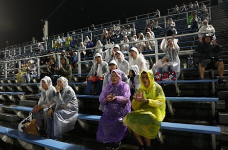 Fans wearing plastic ponchos brave the rain in the stands to watch the Baseball, Men’s Super Round, Taiwan v Japan at the Asian Games, at Okazaki Central Park Baseball Stadium, Okazaki, Japan