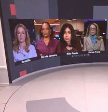 O momento em que Maria Cristina Fernandes (terceira no telão do estúdio) comentou sobre o suposto projeto contra Nossa Senhora que revoltou os católicos Foto: Reprodução/TV
