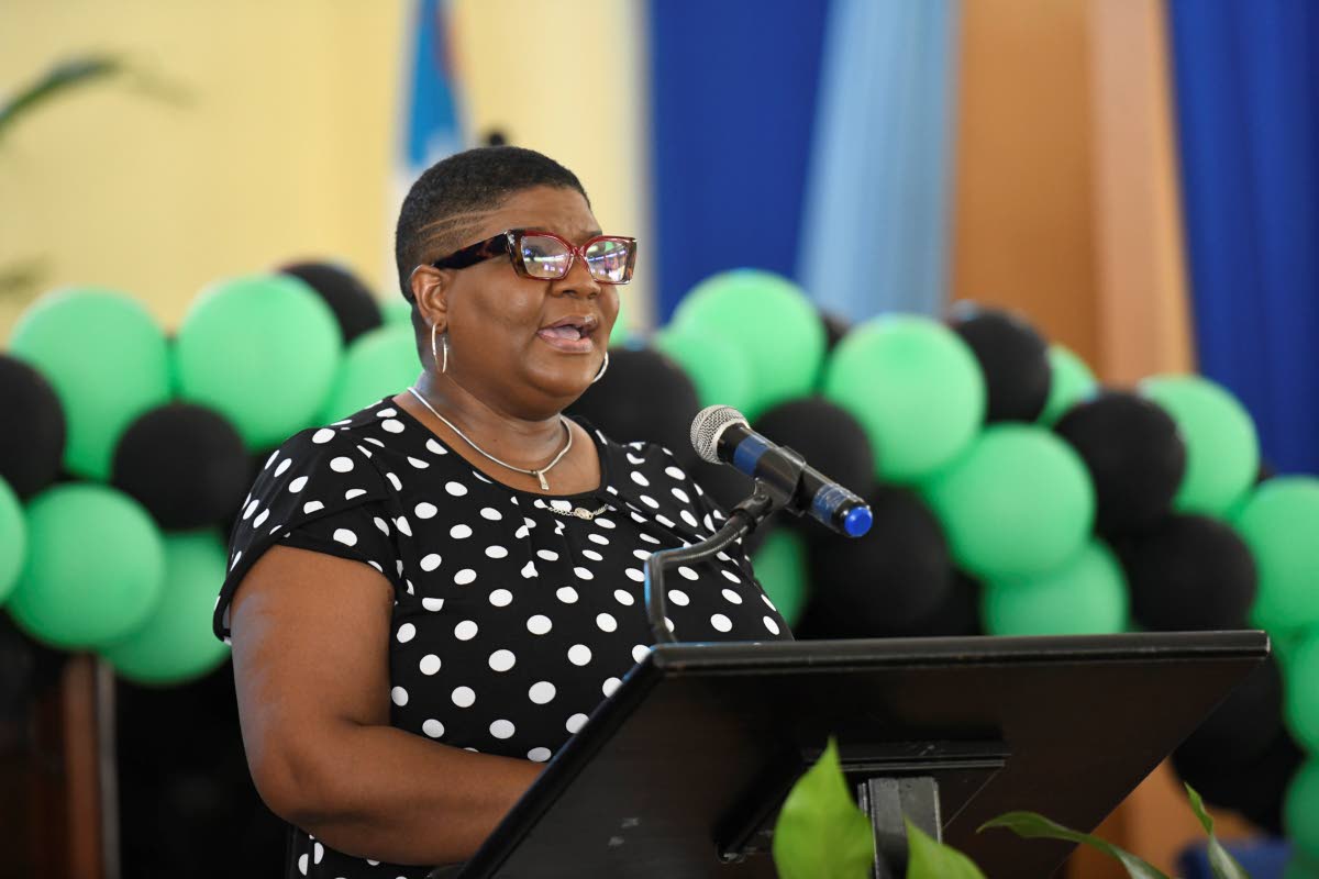 Sian-Mahay Wilson, principal of Calabar High School, brings a tribute at the funeral for veteran broadcaster Dervan Malcolm.