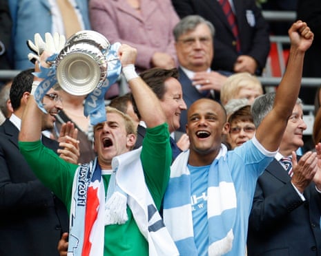 Manchester City’s Joe Hart and Vincent Kompany celebrate after the team’s victory in the 2011 FA Cup final.